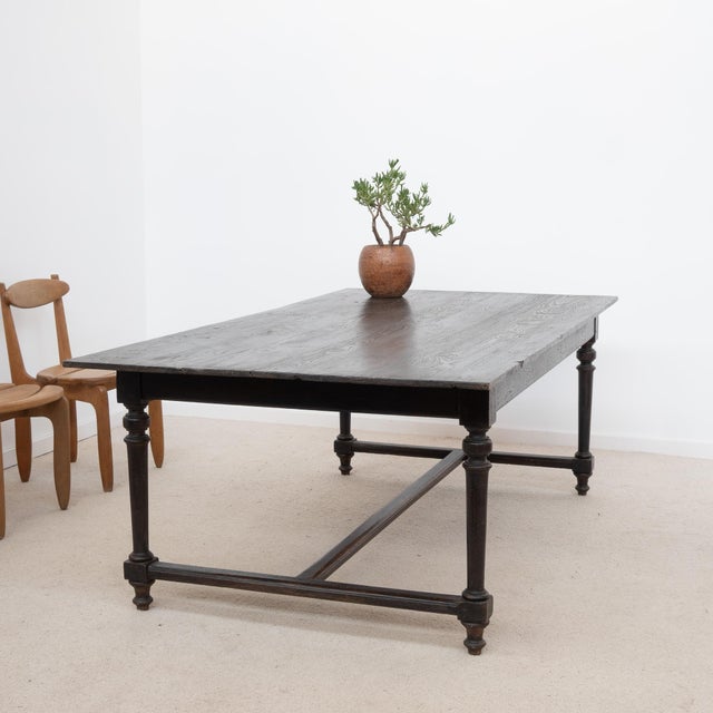 Antique wooden table, early 20th century Original black patina with a waxed finish. Height under the apron: 61 cm