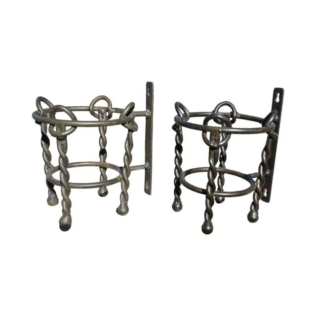 Unique iron work of decorative wall hanging plant or vase holders. Can be used inside or outside.