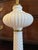 This particularly lovely vintage milk glass table lamp is adorned with swirls and fluting making it exceptionally elegant...
