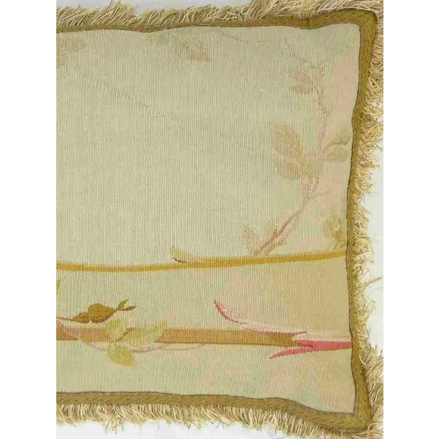 This antique French Aubusson tapestry pillow dates to the 19th century and features a refined floral composition...
