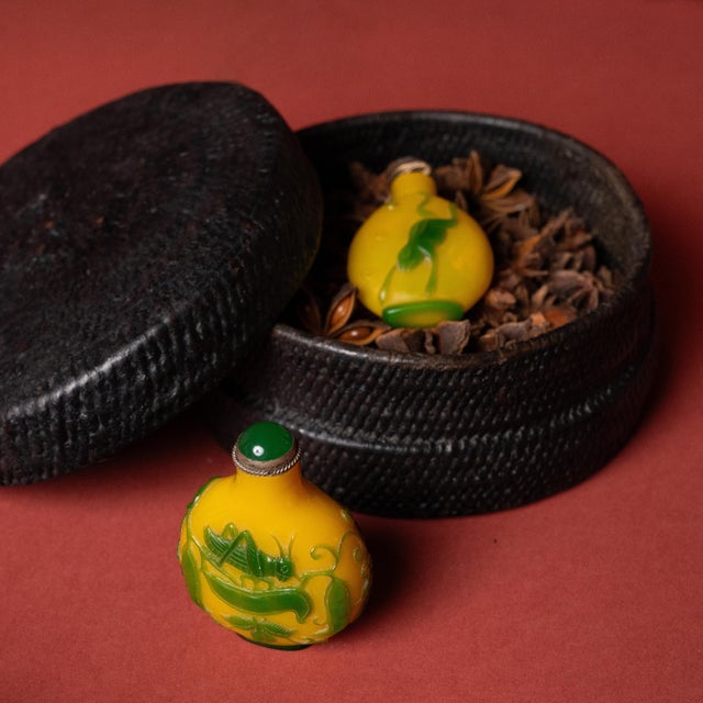 This small woven box from the early 20th century celebrates the beautiful simplicity of a hand-woven object. The round,...