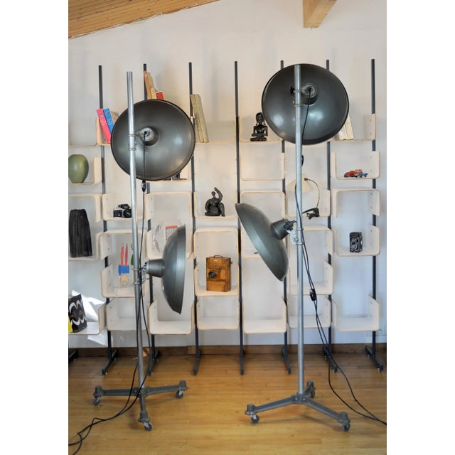 - A set of two photographer's studio lamps from Cremer, France, 1950 - Heavy weighted cast iron base with wheels - Each...