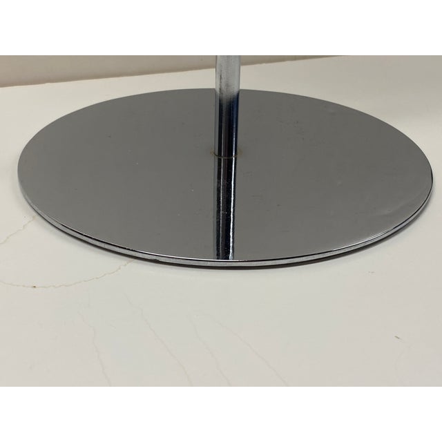 Circa 1960 Hugh Acton cylindrical chrome plated steel ash stand, measuring 25" tall, with a circular base 8.5" in...