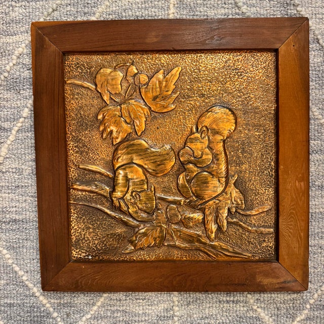 Unique hand hammered repousse copper wall plaque art with a squirrel and tree branch decoration. H 15.25” x W 15.25”