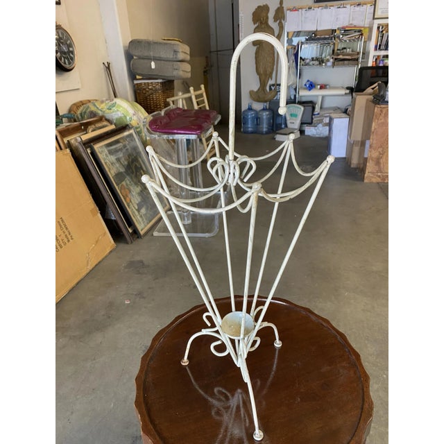 George Nelson inspired iron wire umbrella stand fashioned after the 1948 Vitra Ball Clock designed by Nelson himself.