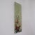 A tall, painted wooden panel, composed like a large cascade of peonies rising from the bottom to the top of the support....