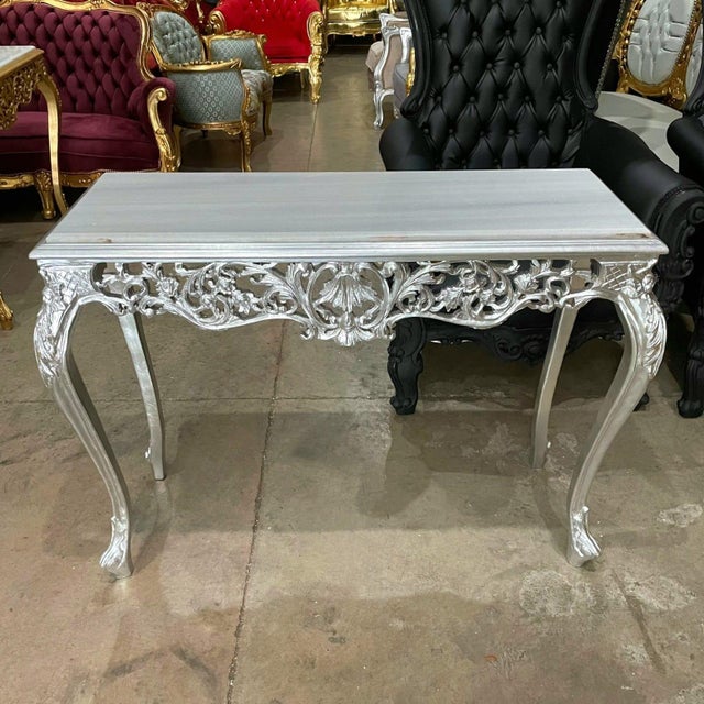 Make a bold statement with this opulent Baroque-style console table, designed to add glamour and timeless elegance to any...