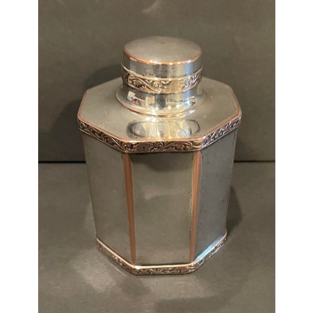 Silverplate tea caddy by the Paul Revere Silver Company of Boston. Round loose fitting lid with applied decorative border...
