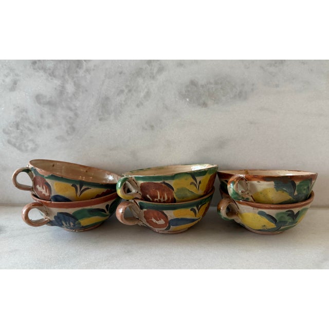 Set of 6 vintage hand painted Mexican ceramic pottery coffee cups featuring traditional folk art designs in muted colors....