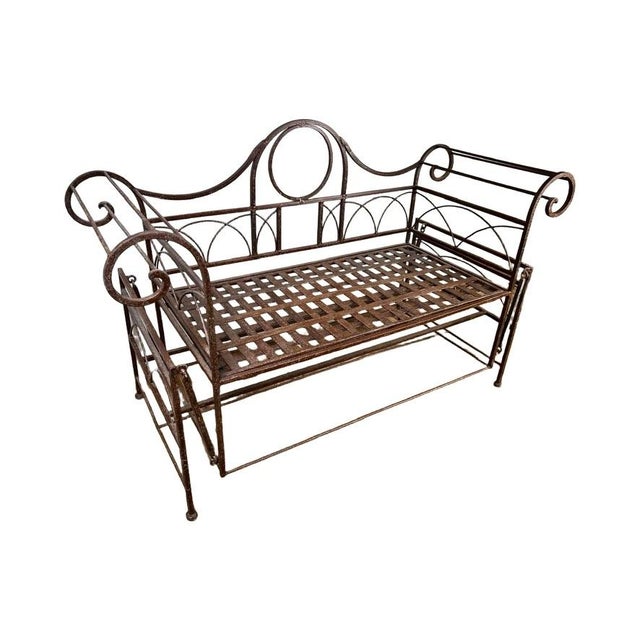 This charming vintage wrought iron porch glider captures the graceful lines and airy elegance associated with Regency-...