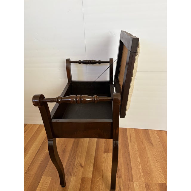 This classic Edwardian-style antique piano stool is an elegant piece for your home. Crafted from a rich, dark-toned...