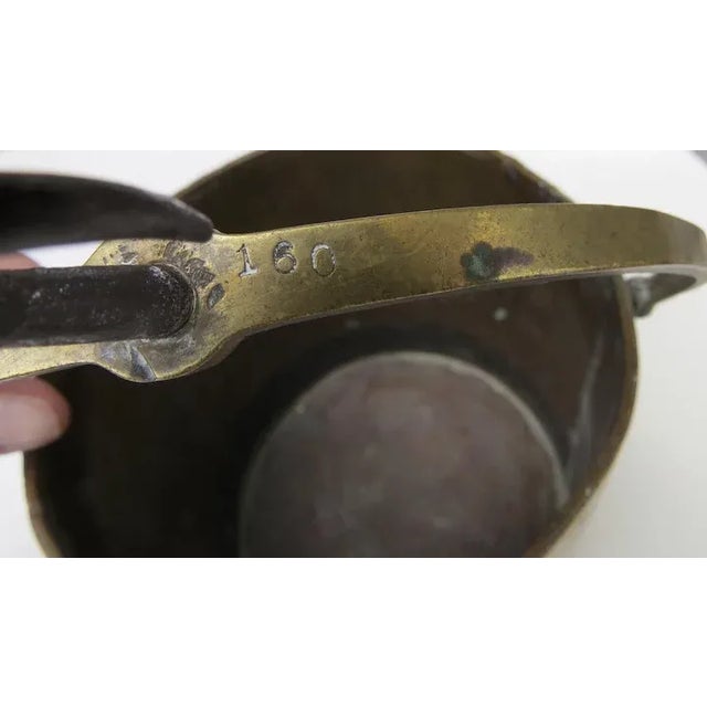 Beautifully made brass bucket with swing handle and iron top hook. Marked 160. Measures 5 3/4" tall by 6" diameter.