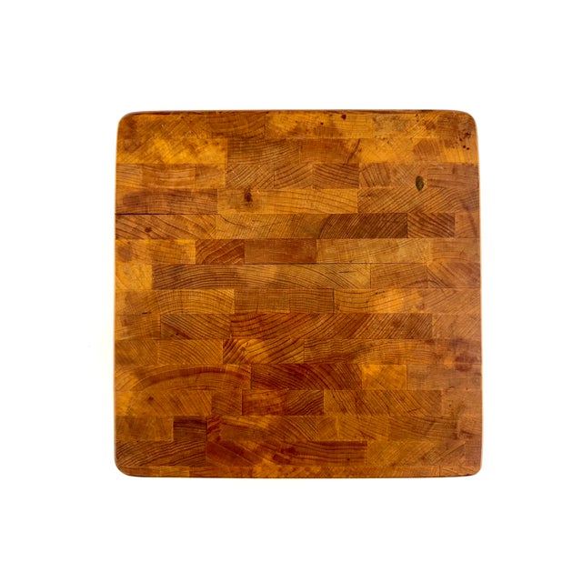 A vintage Bruce Chop Block by E. L. Bruce Co. of Memphis, Tennessee, crafted from substantial end-grain hardwood in a warm...