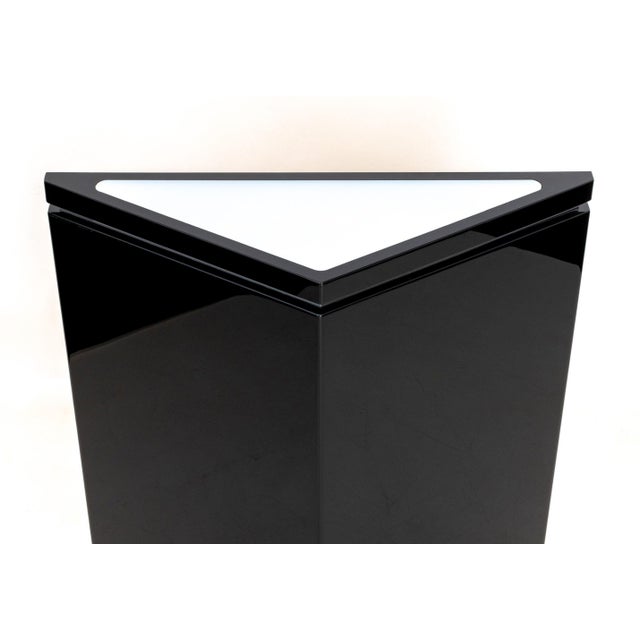 Postmodern Black Lacquered and Chrome Illuminated Triangular Pedestal, with frosted Plexiglas to the top and chrome base....
