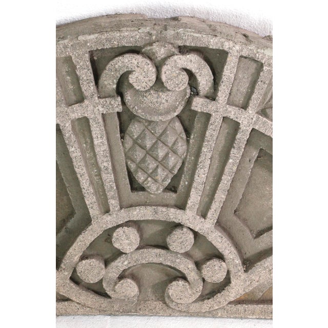 Carved limestone pediment with a center pineapple motif and ornate scrolling details throughout. The manufacturer and...
