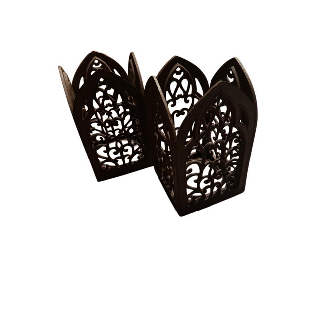 Dramatic and exceptionally substantial pair of vintage cast iron Gothic cathedral candle holders featuring elaborate...
