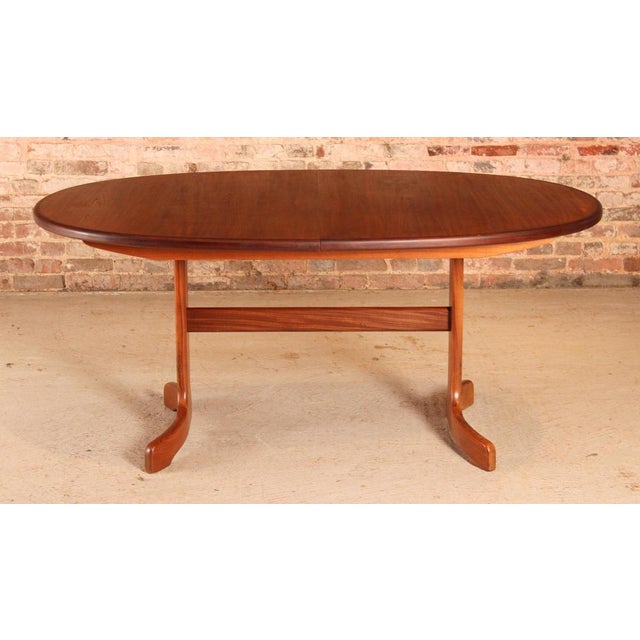 Mid century g-plan fresco extending teak and afromosia dining table, circa 1970s. A butterfly extension leaf stored...