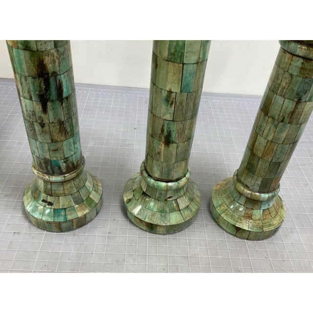 They have unique design in celadon green color. The heights are different - about 15", 18" and 21" tall. The bases and the...