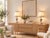 A matching pair of Hollywood Regency table lamps featuring urn-shaped bases with fluted and beaded details, finished in an...