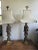 A striking pair of Hollywood Regency figural table lamps featuring robed Asian figures rendered in a rich bronze-tone...