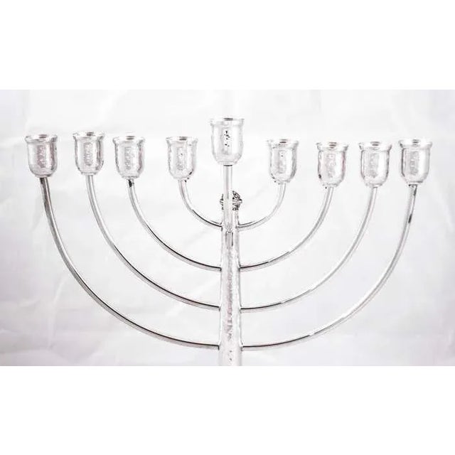We are delighted to offer this sterling silver menorah that is made in Israel. The festival of lights, as Hanukkah is...