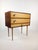 A stylish piece of furniture in the spirit of Mid-century Modern, combining the function of a sewing table with the...