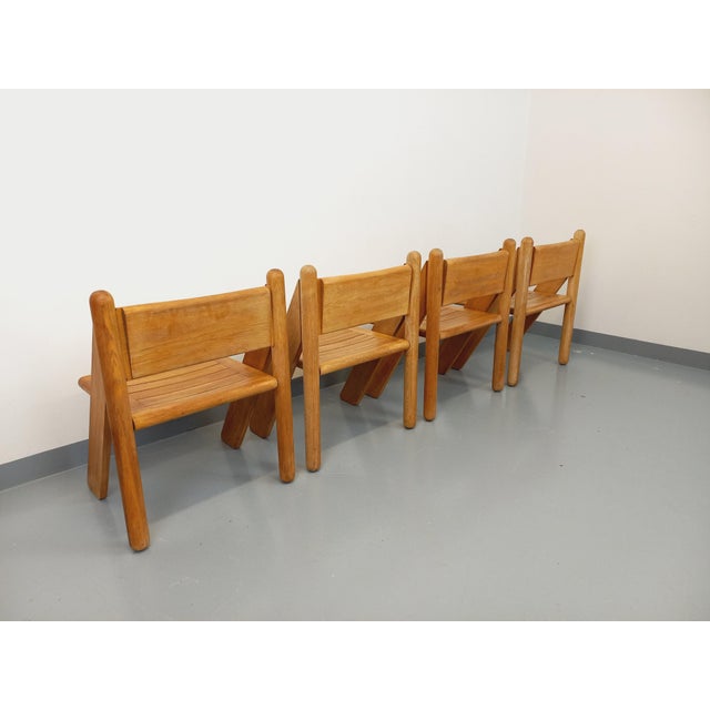 Set of four stunning A-frame chairs, vintage from the 1960s/70s, crafted from solid oak. Manufactured by Fratelli Montina,...