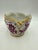 French porcelain cachepot / planter with a scalloped gilt rim and hand-painted magenta (puce) floral panels. Marked 'LM —...