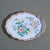 Standing rim enameled brass shaped pin tray. The decoration of mums & cherry blossoms on a periwinkle blue ground is...