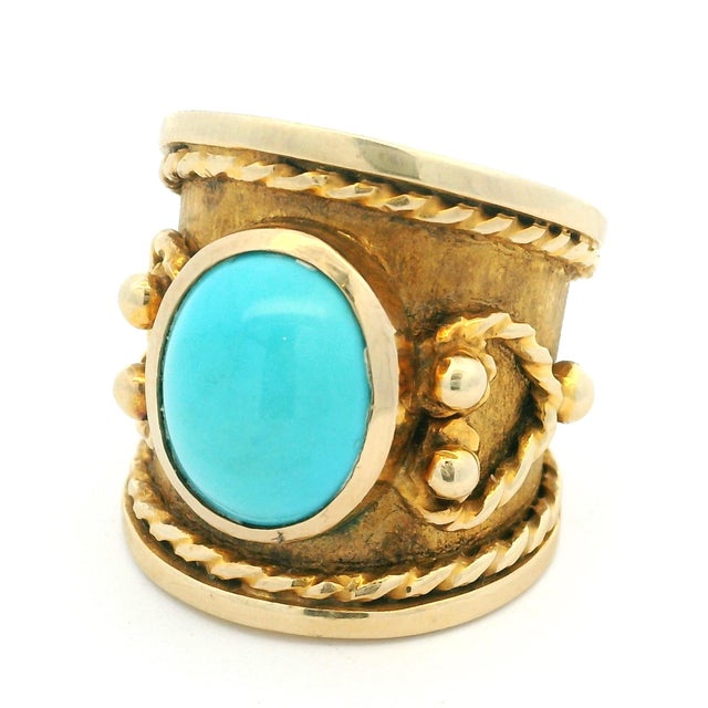 A bold and beautifully sculptural vintage Italian statement ring, crafted in rich 18K yellow gold and centered with a...