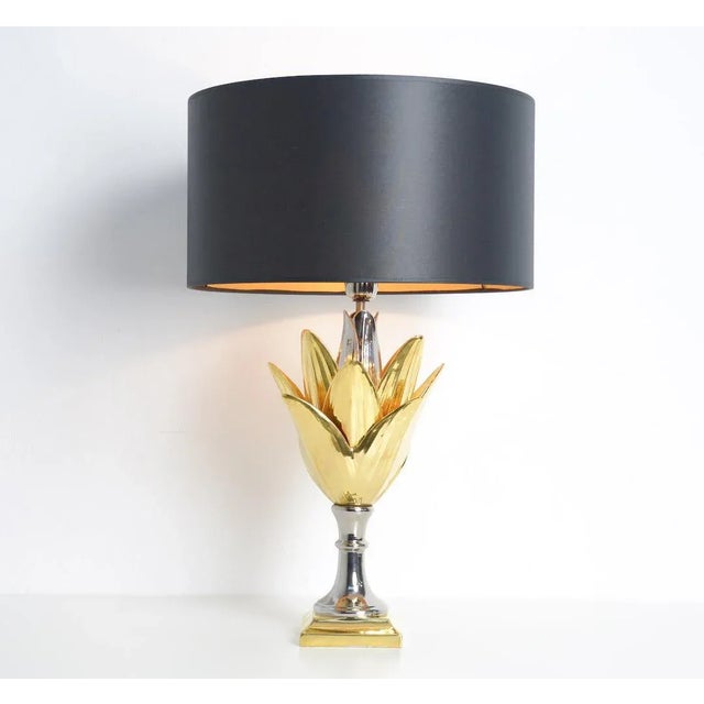 This impressive table lamp is made of earthenware with gold and silver glaze. It is a special piece made in Italy and...