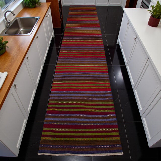 Woven in the 1970s in the Eskişehir region of Central Anatolia, this extra-long Turkish kilim runner brings a strong sense...