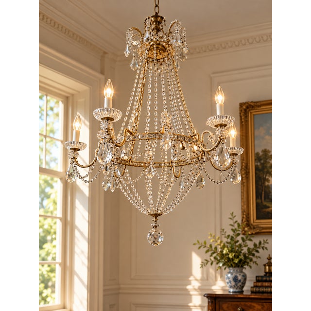 This vintage Empire style six-light chandelier is an elegant example of neoclassical revival design, combining classical...