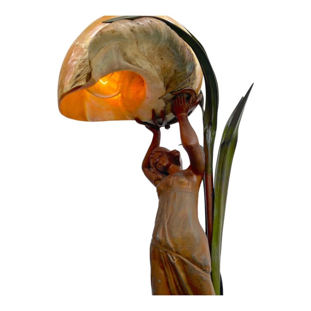 Beautiful French Circa 1900 Gilt Metal Art Nouveau Nautilus Shell Lamp with a woman holding up the shell with long leaves...