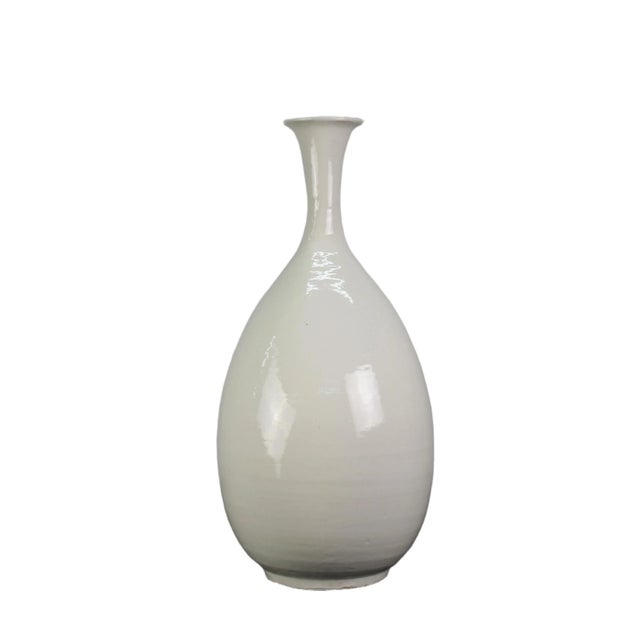 This chic white fine vase is handmade with natural variance, The elegant simplicity of the design make this vase a...
