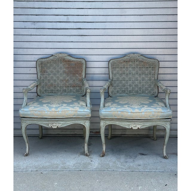 This wonderful pair of Louis XV armchairs has timeless look and design, great color and solid construction. Both chair...