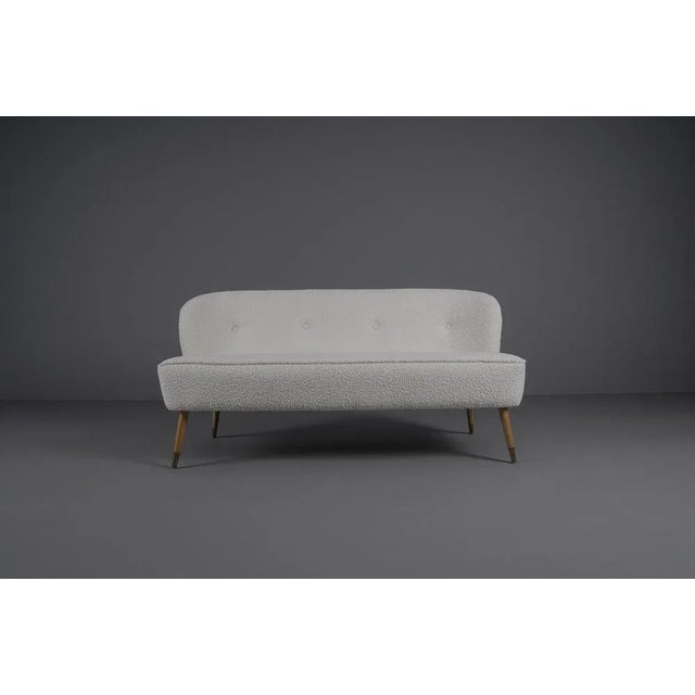 We have newly obtained the armchair with a boucle upholstery in white. Seat height 40cm.
