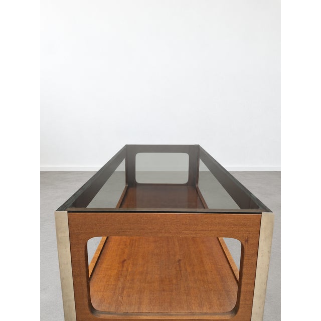 A stunning vintage Mid-Century Modern coffee table dating back to the late 1960s/early 1970s, strongly inspired by the...