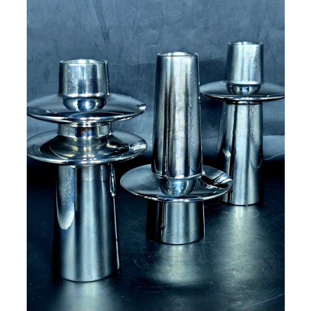 Georg Jensen set of three stainless steel candlesticks, designed by Rebecca Uth, Denmark, 2000s. Each is 5.3" tall. Very...