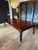 Large antique mahogany dining table suitable for 10 to 12 people with original extra leaves. Because it is a wind out...