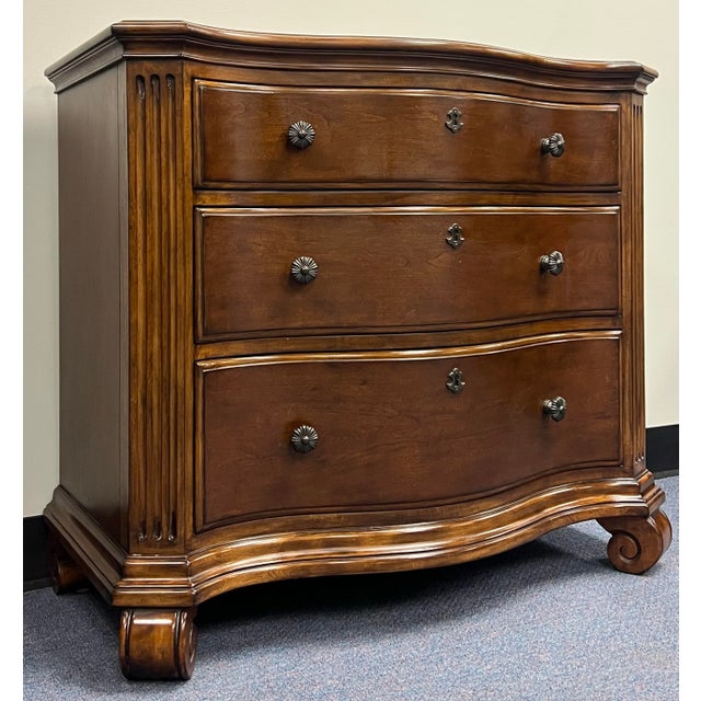 Beautiful cherry three drawer commode / nightstand by Ethan Allen from their Tuscany Collection. Features three dovetailed...