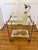An elegant, fabulous mid-century brass coffee table or side table from the 1950s, featuring two crystal glass tops with...