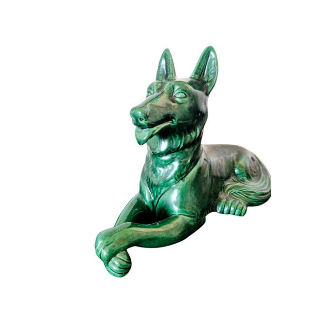This emerald green glazed ceramic sculpture is a mid-century masterpiece from the renowned Saint Clement factory in...