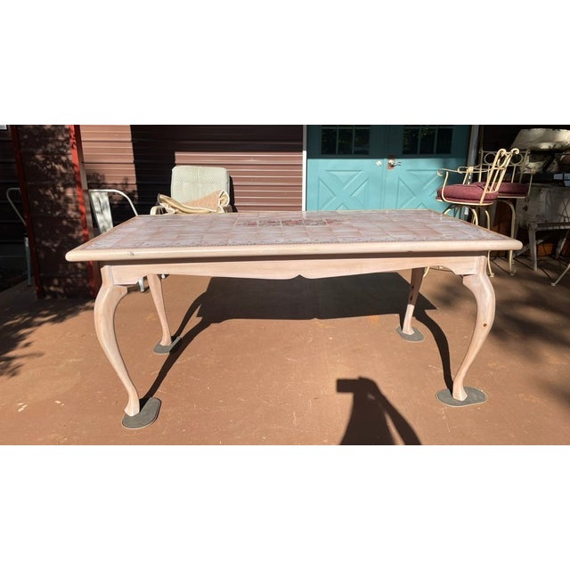 This pretty table is in good / solid condition. The top is tiled, appears handmade, & is not total perfection. Very shabby...