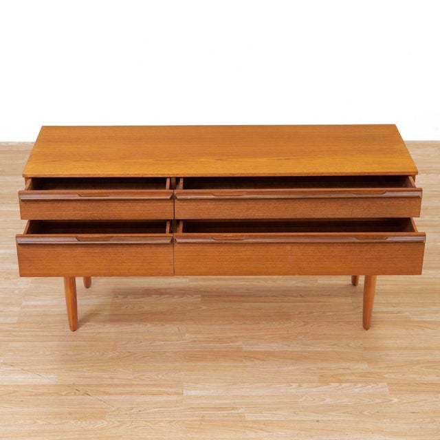 This vintage mid-century console dresser was produced by Avalon Yatton during the 1960s. An elegant design the console has...