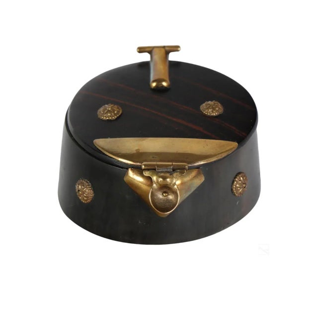 An antique 19th Century Victorian carved horn and coromandel wood snuff box. Hinged and lidded box with rounded carved...