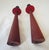 Rare Pair of teak candlesticks with black metal top with red underside. Each measures 10"H x 1.75"D. Both are in excellent...