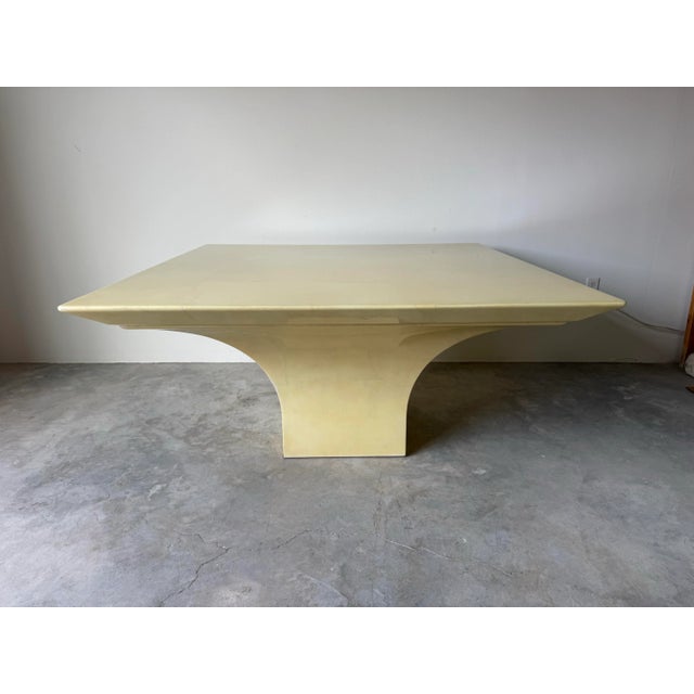 Elegant and sculptural 1980s Karl Springer–style square dining or conference table, masterfully crafted with a lacquered...