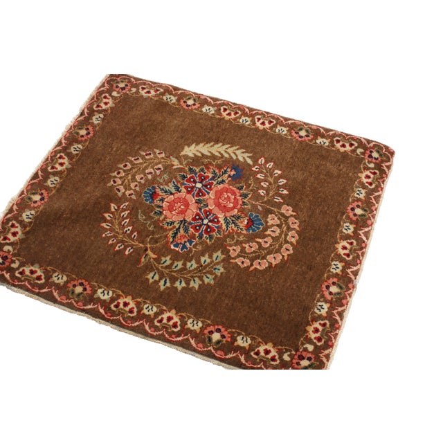 Originating from Persia in 1900, this hand-knotted wool antique Persian rug enjoys a distinguished classical combination...