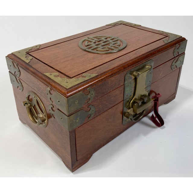 Beautiful vintage rectangular rosewood jewelry box with brass detail. Sturdy brass handles on both ends. The bottom drawer...